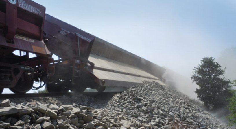 Ballast dumping railcar in operation