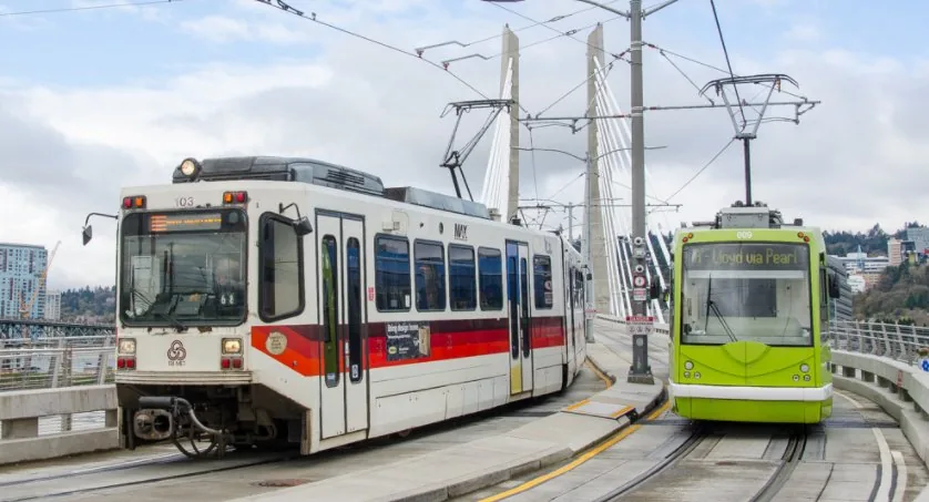 Light rail vehicles crossing a bridge